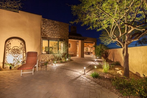 large house with landscape lighting
