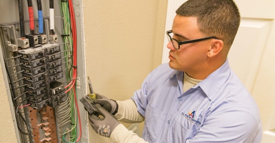 electrician working on panel