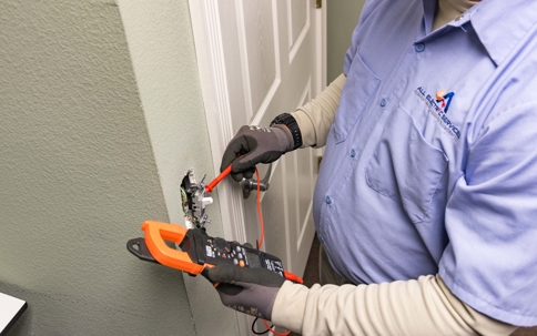 electrician repairing an outlet